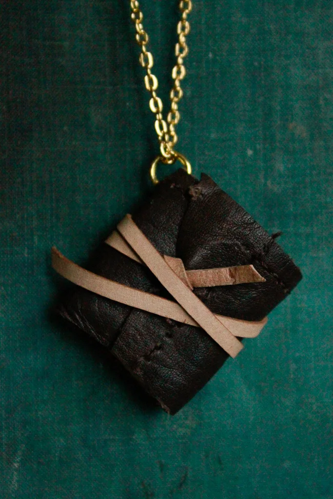 Cacao | Miniature leather book necklace with hemp drawing paper