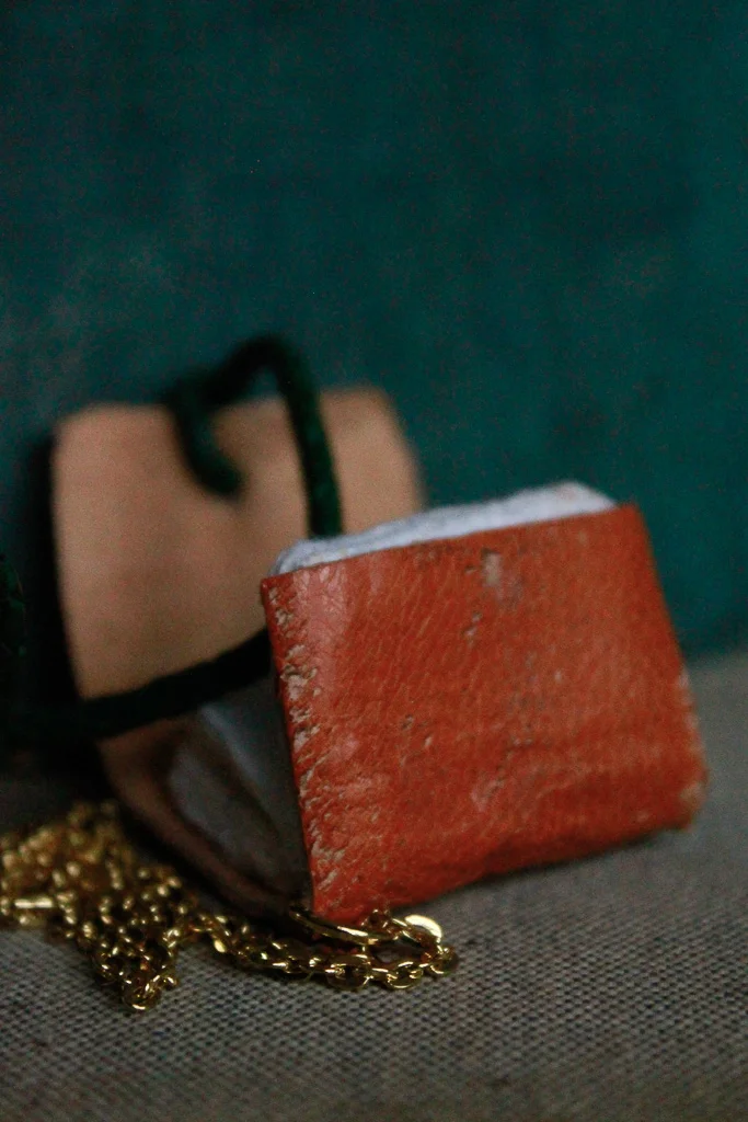 Tangor | Miniature leather book necklace with hemp drawing paper