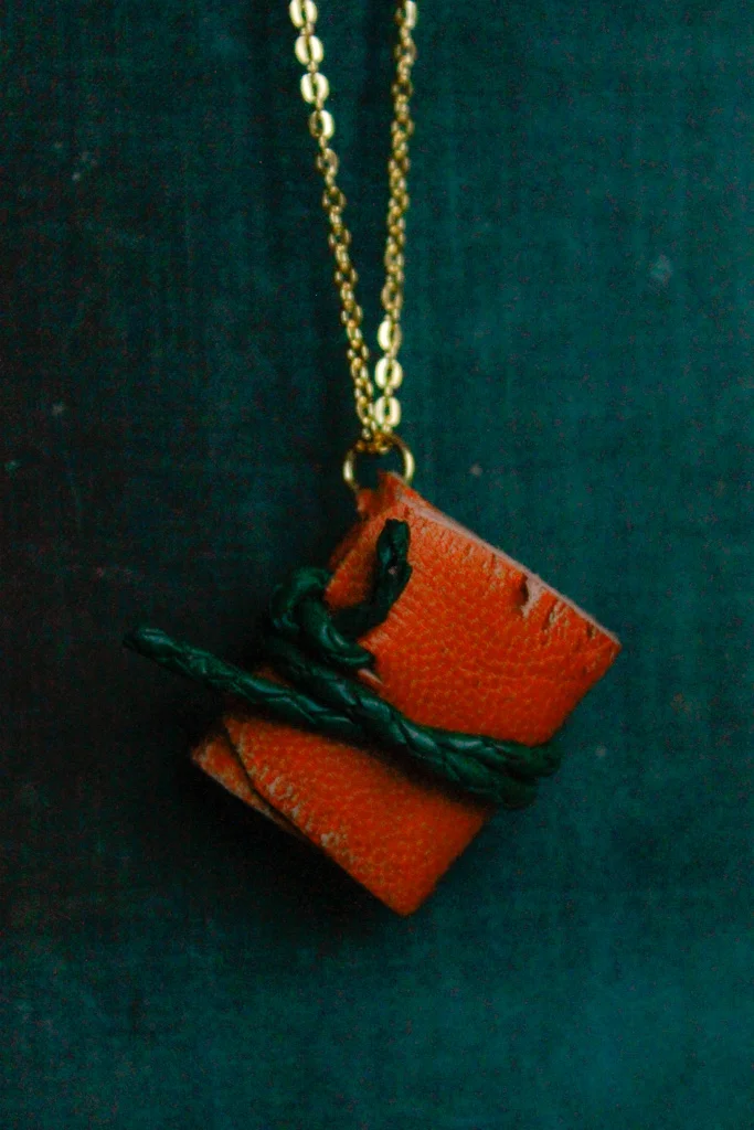 Tangor | Miniature leather book necklace with hemp drawing paper