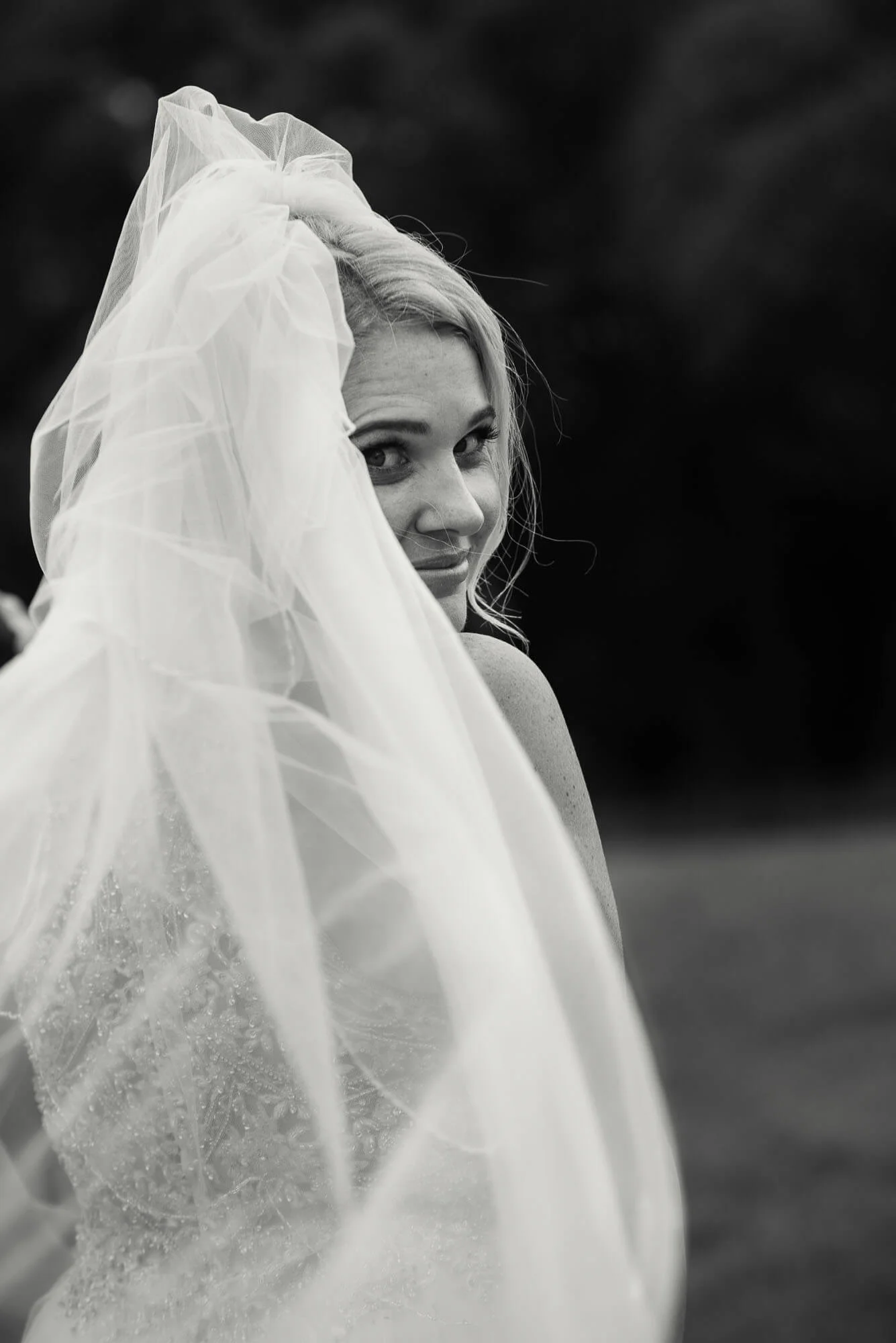 bride-looking-over-her-shoulder-black-and-white.jpg