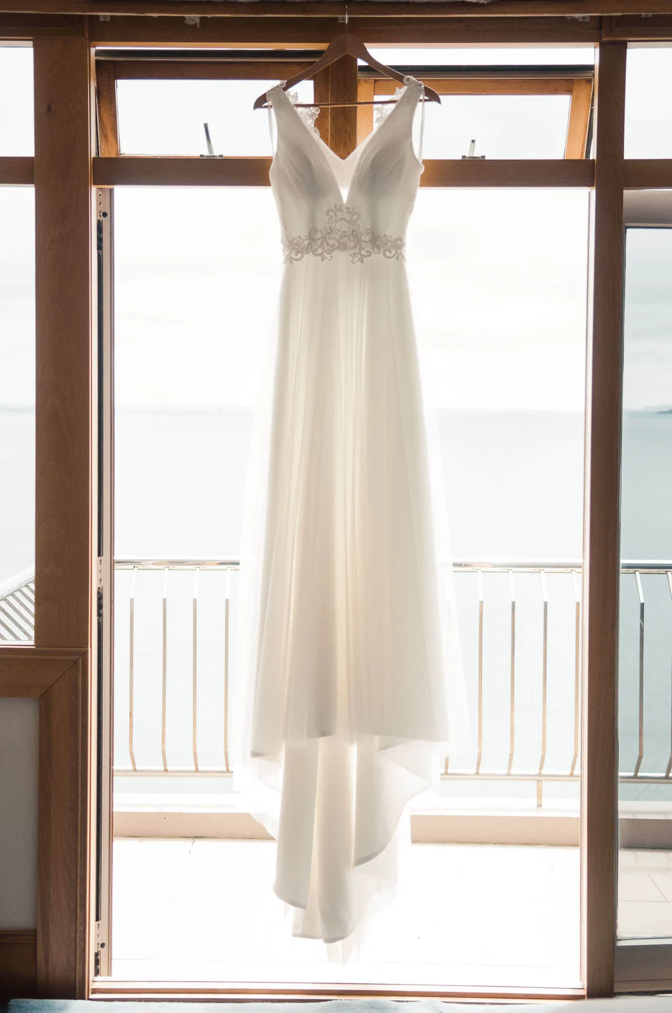 wedding-dress-hanging-in-window.jpg
