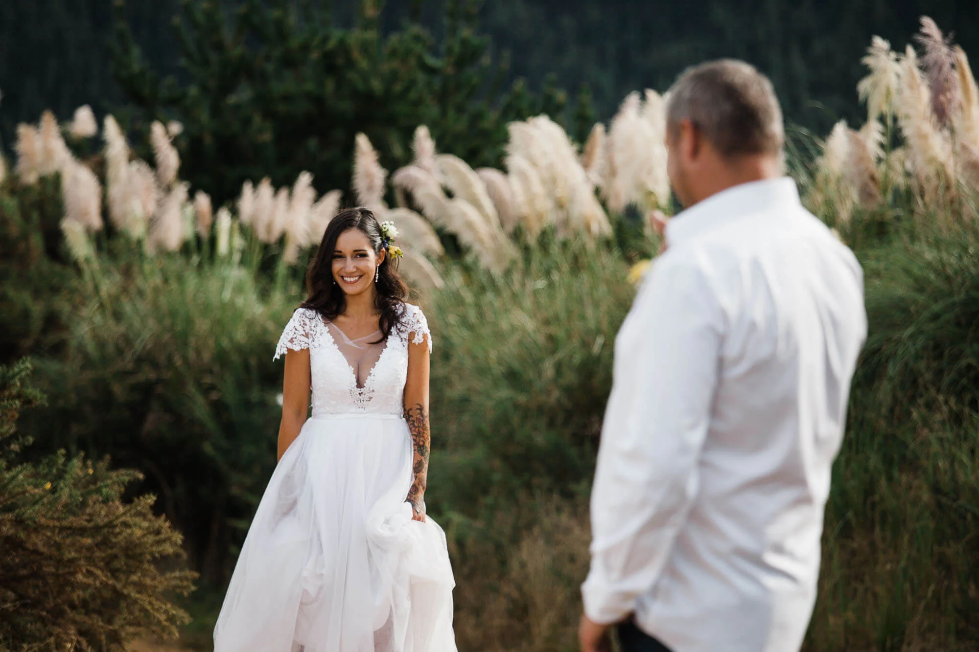 bride-walking-towards-groom-boho-outdoor-wedding.jpg