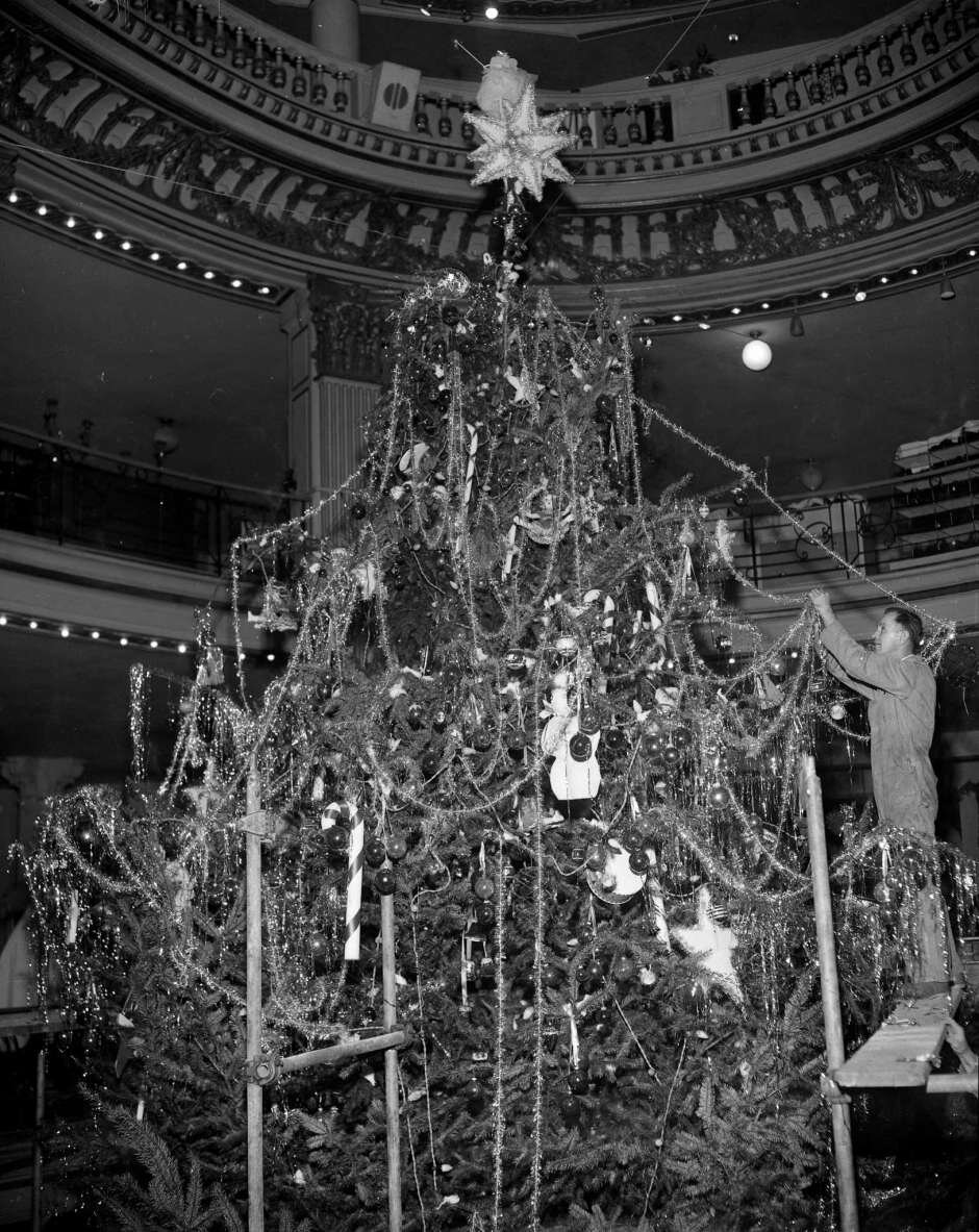 The City of Paris Christmas tree goes up in 1954.