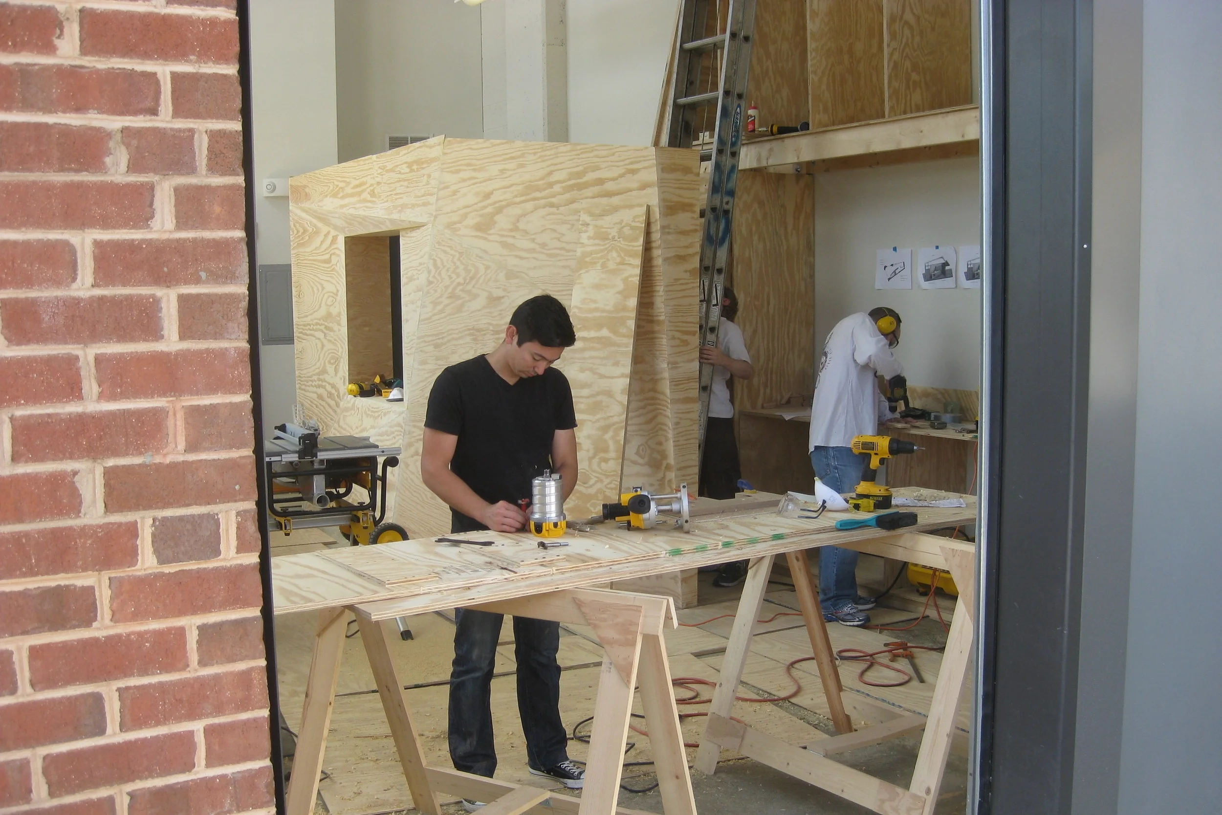 Volunteer builders construct the ARTillery.
