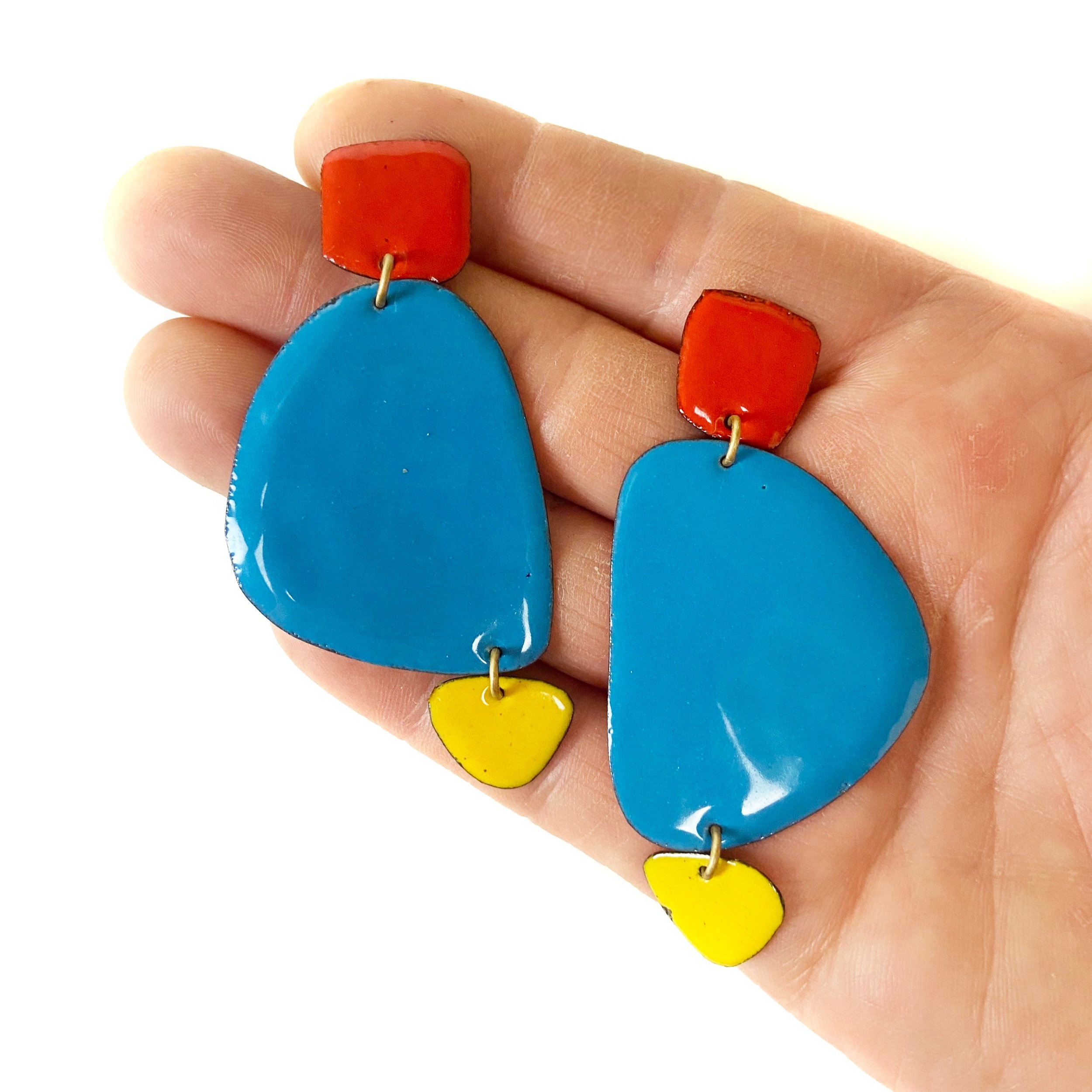 Large+Caveman+Earrind+Red+Blue+Yellow+Hand.jpg
