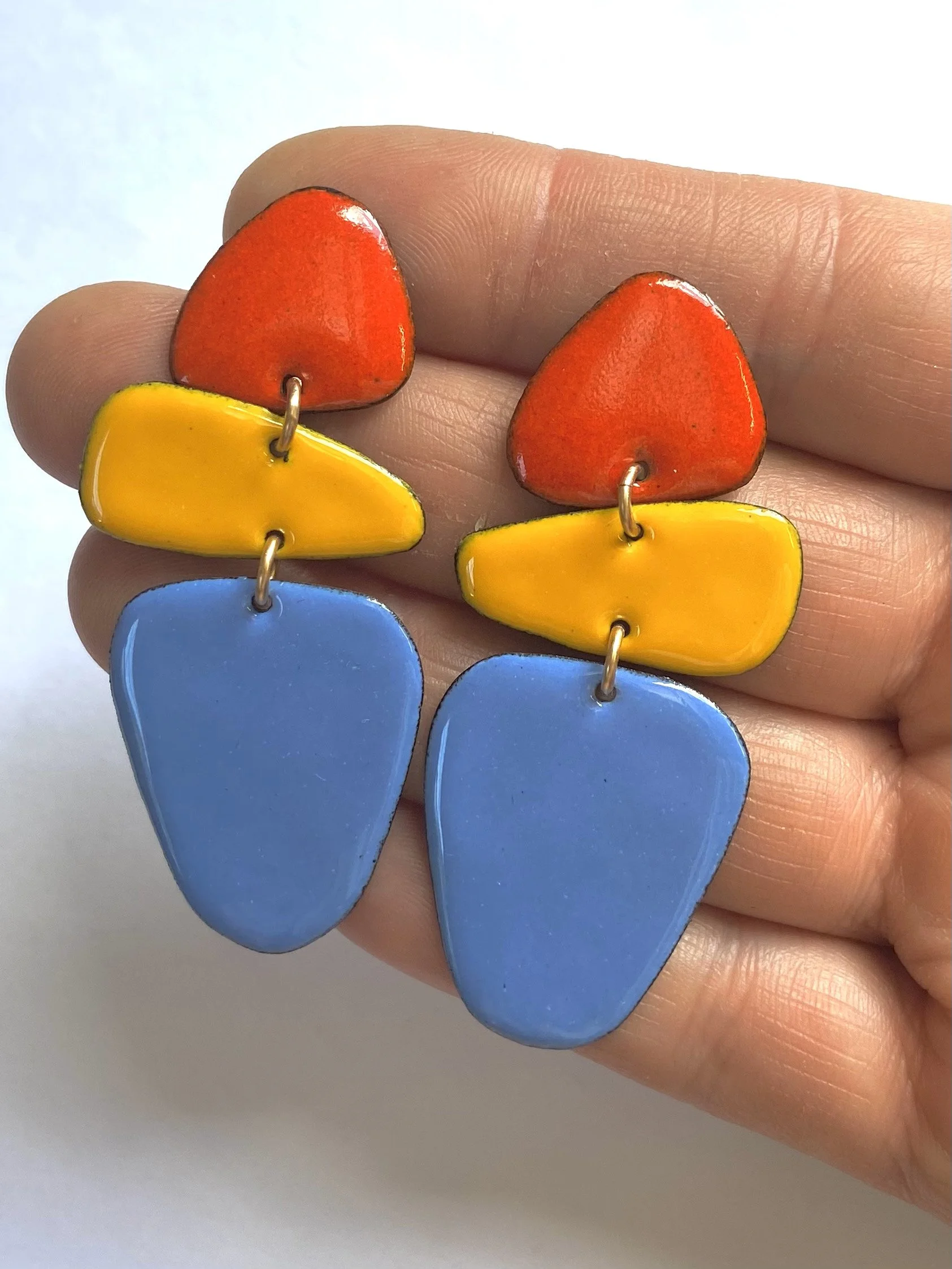 Caveman earrings hand.jpg