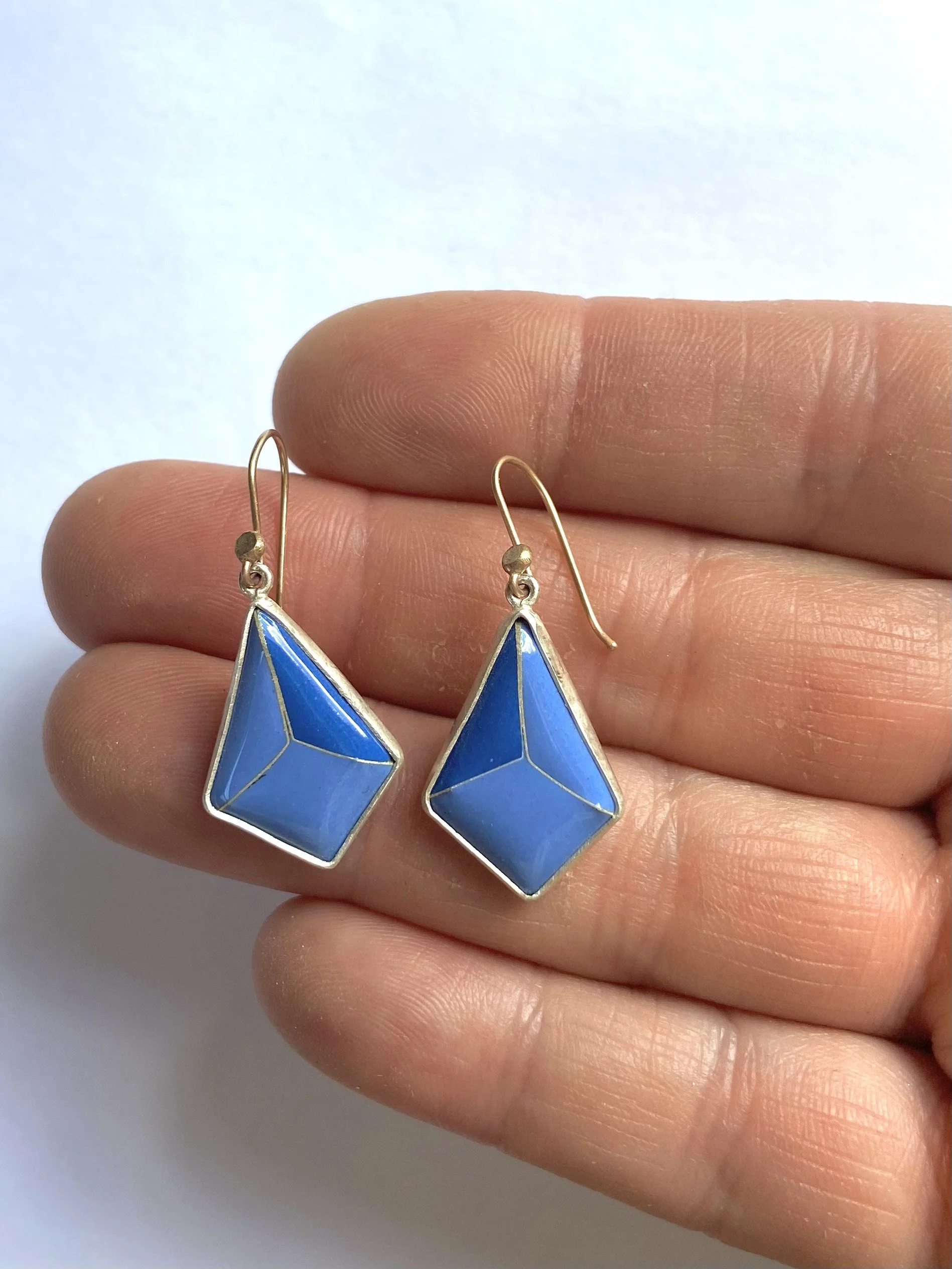 blue diamante earrings hand.jpg