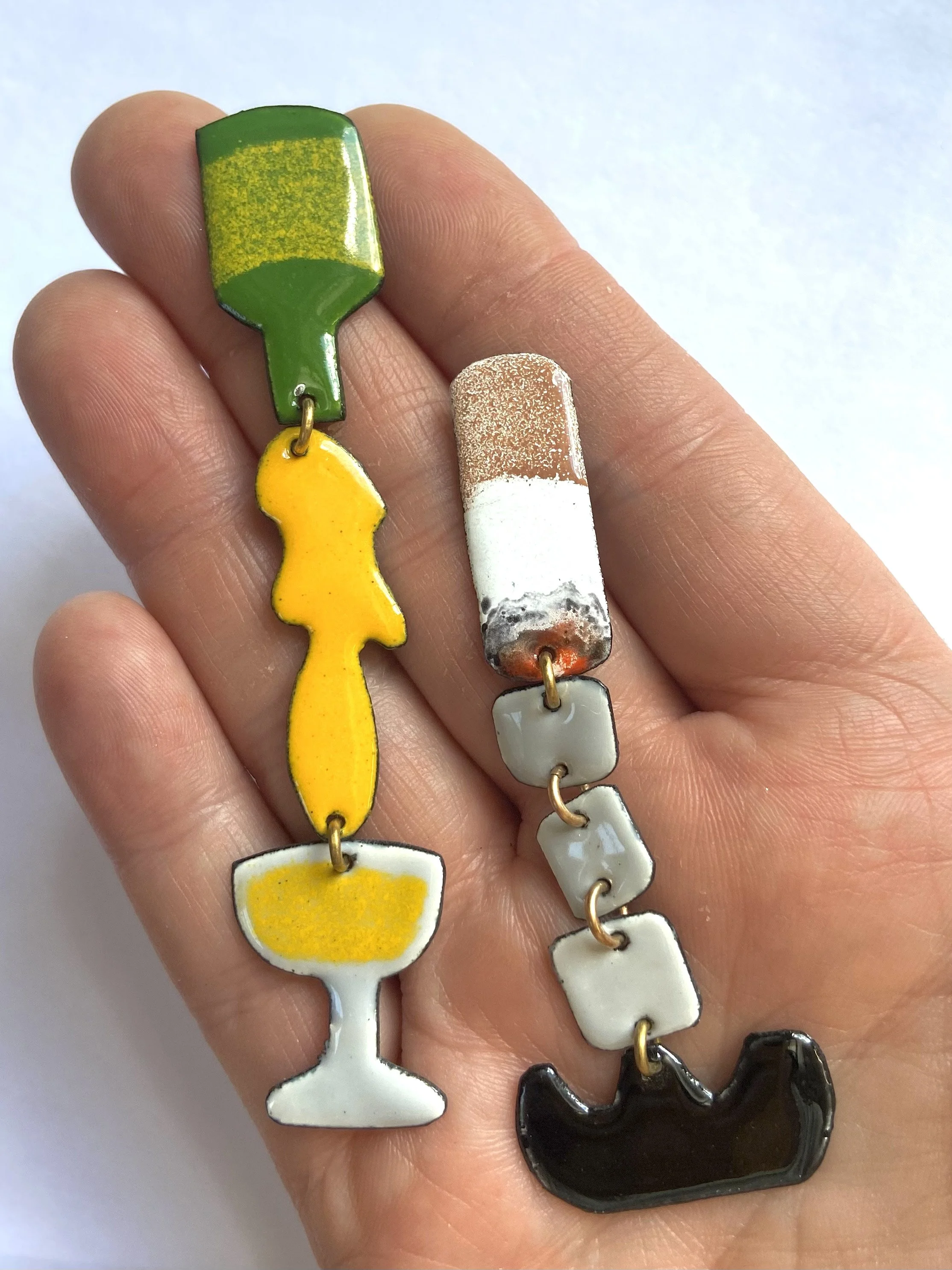 Champers and Cigs earrings hand.jpg