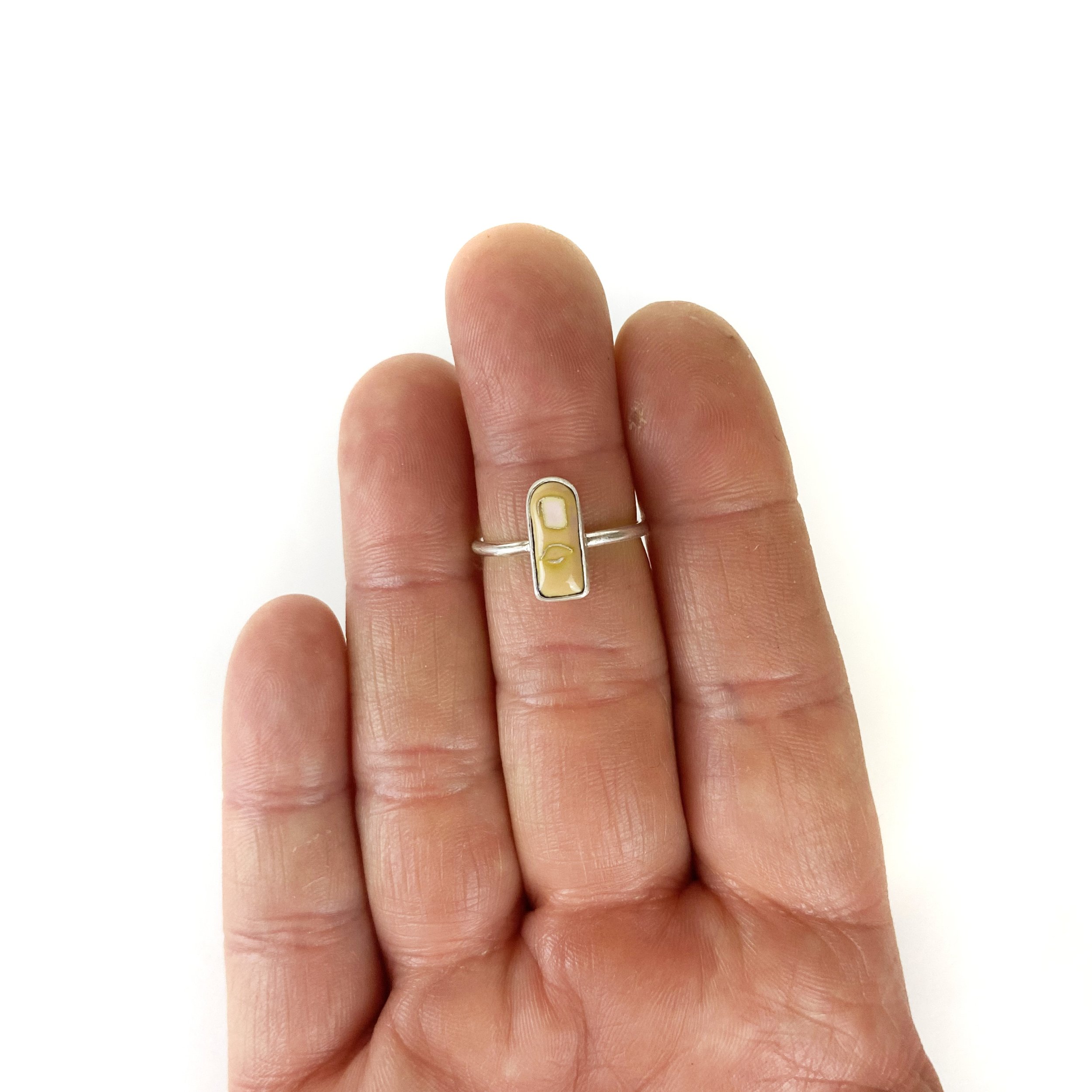 Tiny pale finger ring hand.jpg
