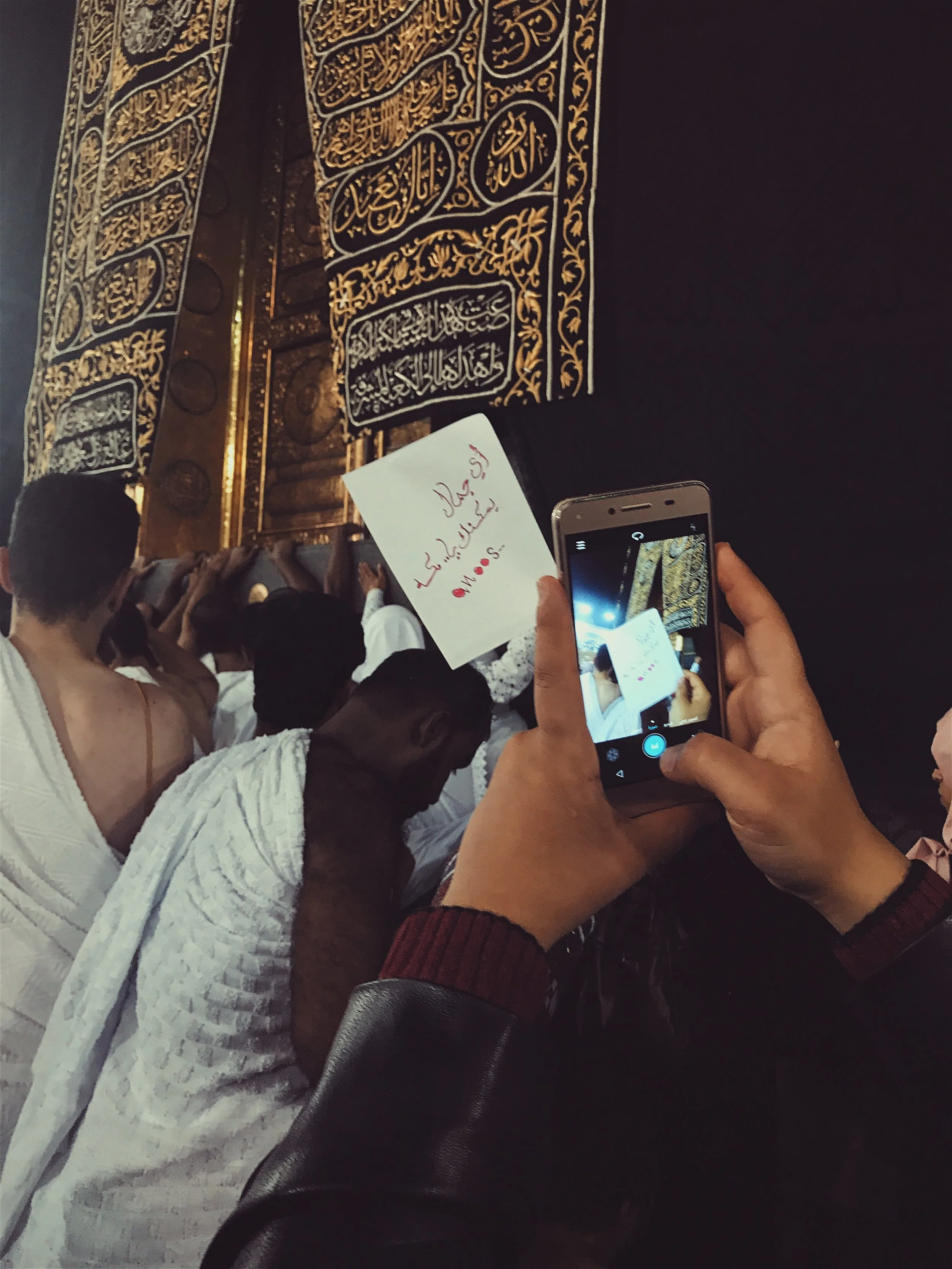  A pilgrim takes the time to send a message home. Technology is conspicuous even while on pilgrimage. You can often see people documenting and even live streaming their experiences to share with friends and family who could not make the journey (much