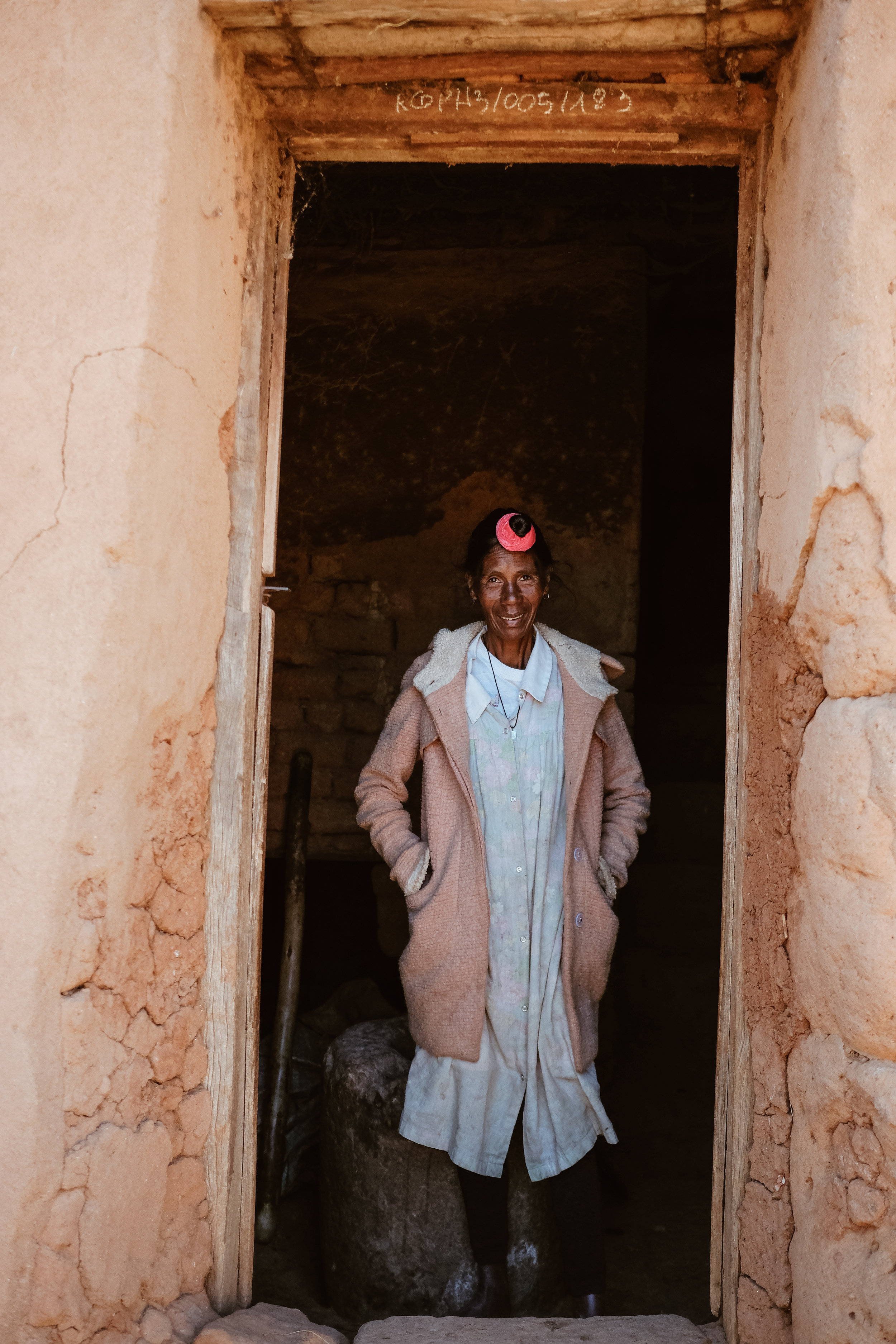 While walking, we met Bebe Felicite Augustin, who agreed to let us see inside her traditional home. The ground level houses her animals—a pig, two ducks, and some chickens—while the top floor is where the family lives. Bebe Felicite mentioned that s