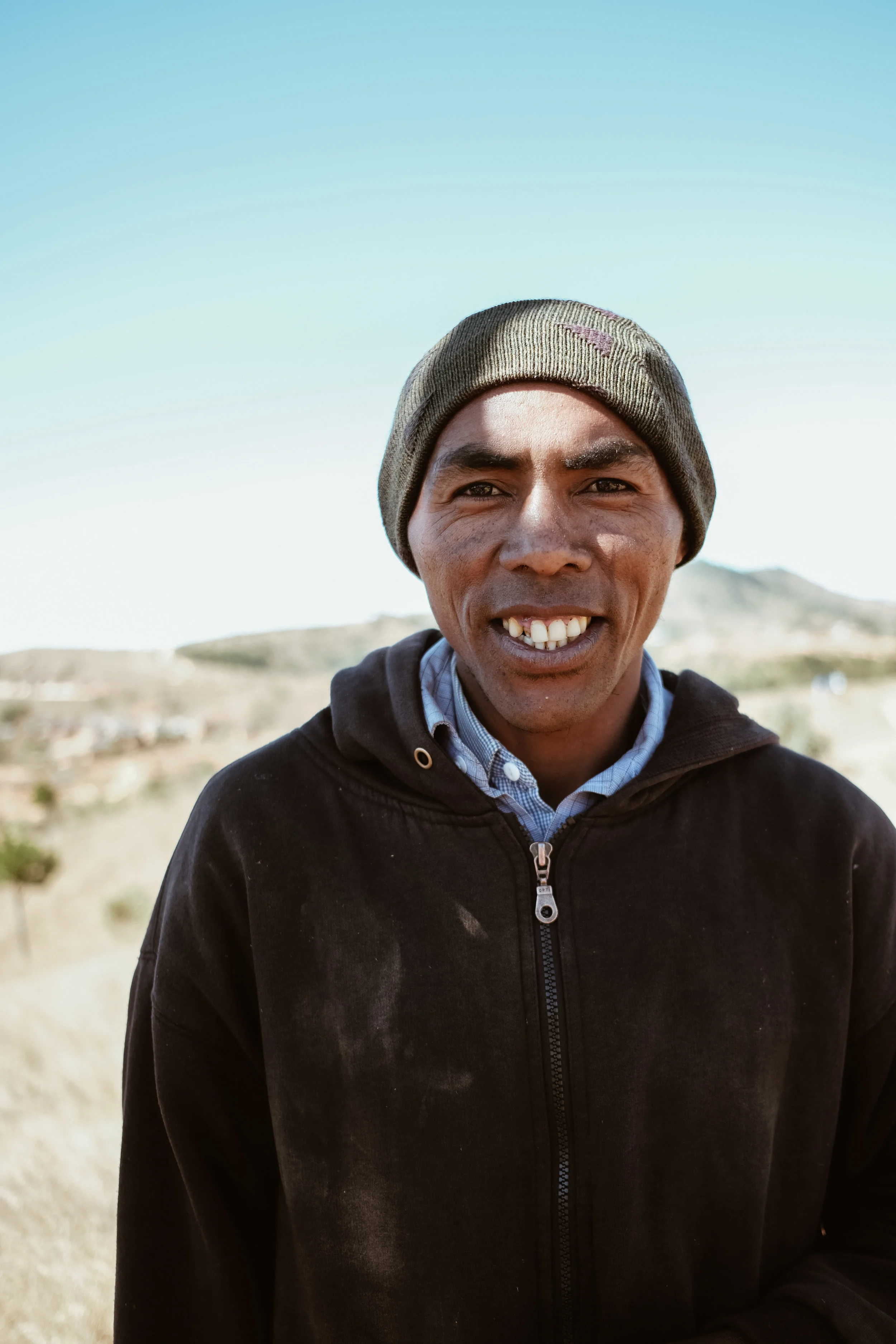 While we waited, a couple of people asked for their portraits to be taken. Dede, pictured here, would end up being our ‘inside man’ at the Famadihana, telling us where to stand and how close we could get while remaining respectful of the ceremony. H