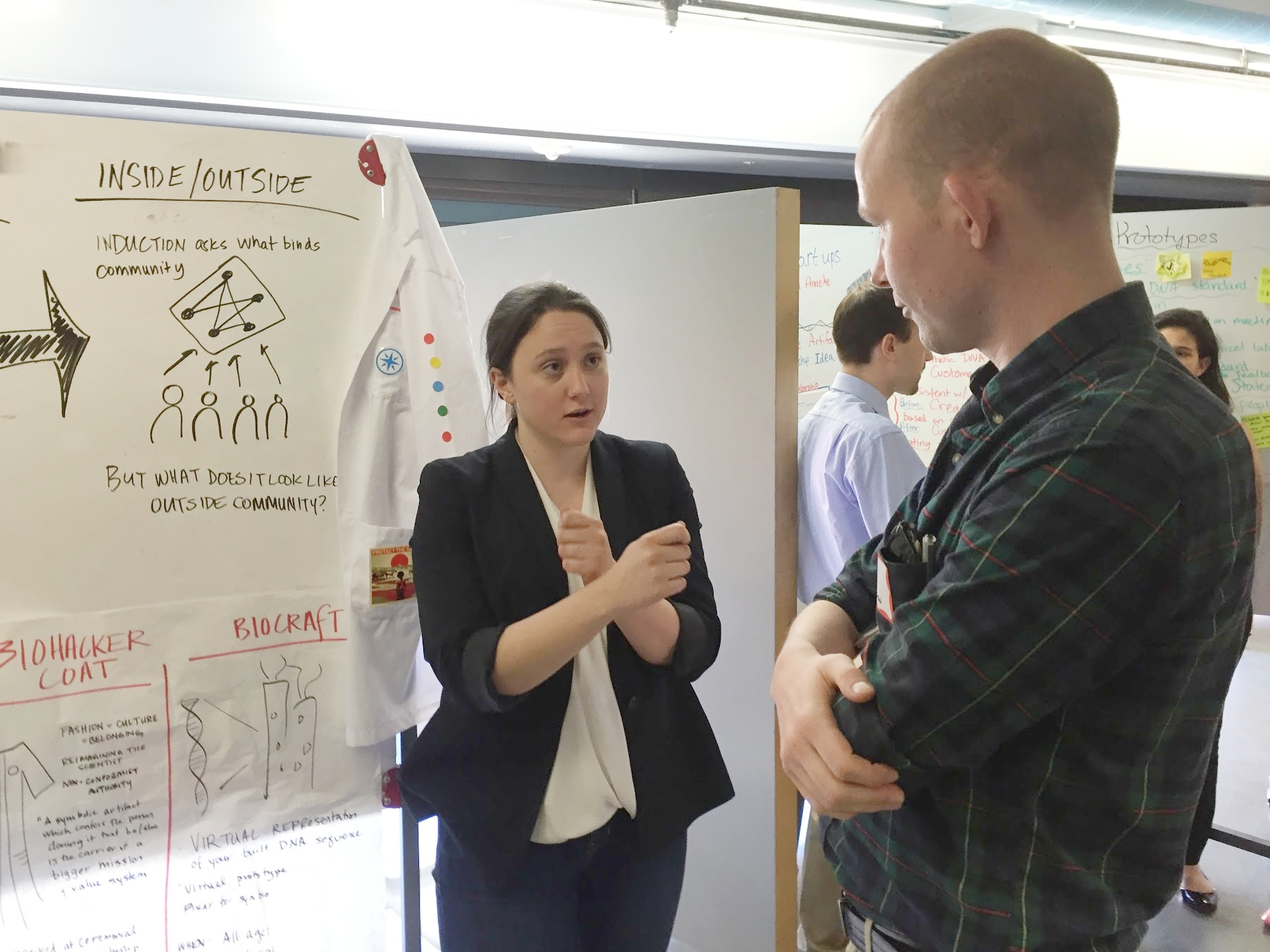 Business and policy student Kate O’Gorman describes her team’s behavior change prototypes to a visiting expert during a Design Thinking for Public Policy Innovators design review.
