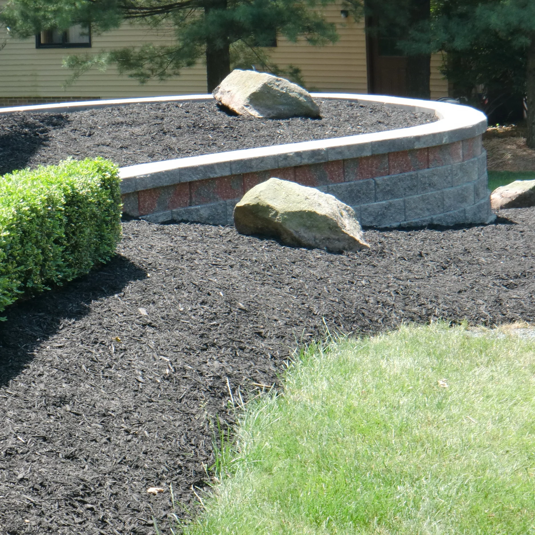 Retaining walls do a great job of adding dimension to landscapes. They also tie in the flowerbeds with the house to create a property that looks whole and complete from the street.