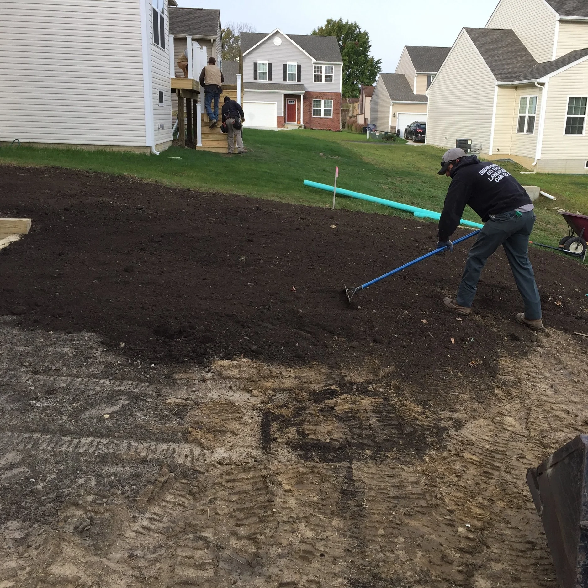 Jordon preparing the sloped yard for the new lawn!