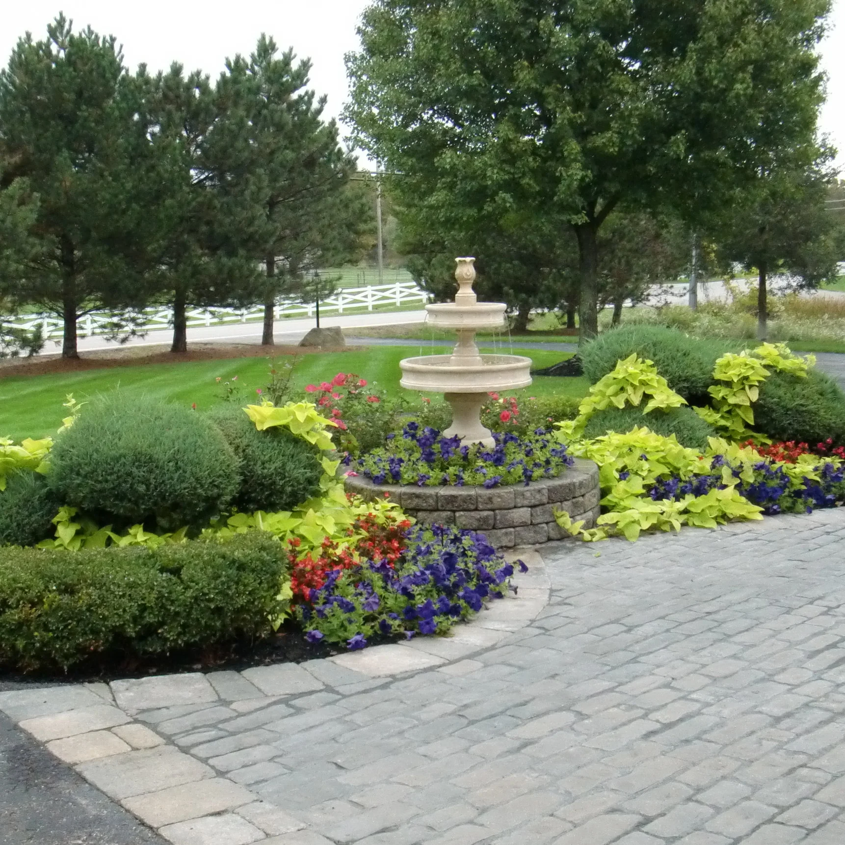 The flowers and fountain make a bold statement!