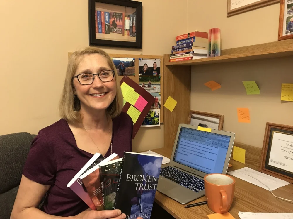 That looks like a pretty clean desk. And I love her love of post-its (just like mine...).