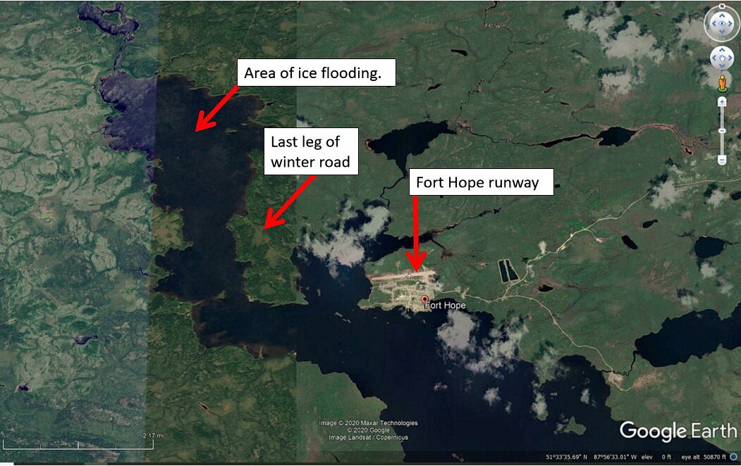 照片1:谷歌地球图片冬天最后一公里的路到堡希望,只使用一个夏天的卫星图像。箭头显示:a)冰路洪水的地区;b)最后土地腿整个半岛;和c)希望堡的位置…