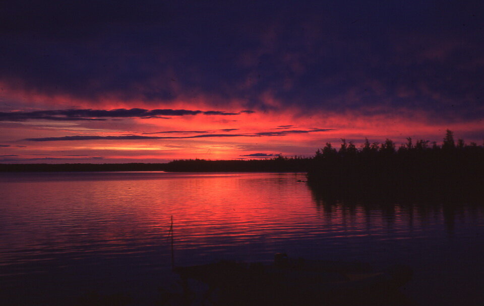 Photo: One of the many sunsets that we saw while in a fly-in tent camp on McVickar Lake, northwestern Ontario, Canada. Photo composed by Andy Fyon during the summer of 1975.