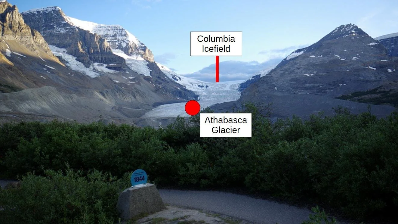 The Athabasca Glacier surrounded by mountains.
