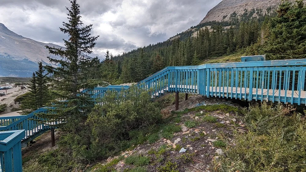 A blue walk way crosses over the terminal moraine created by the Athabasca Glacier in 1844.