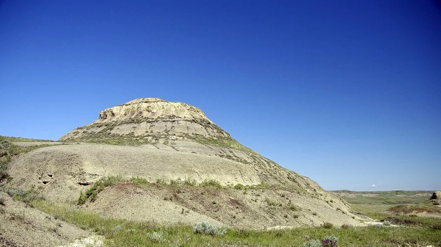 Blue sky and a butte in Grasslands National Park, Saskatchewan, Canada.