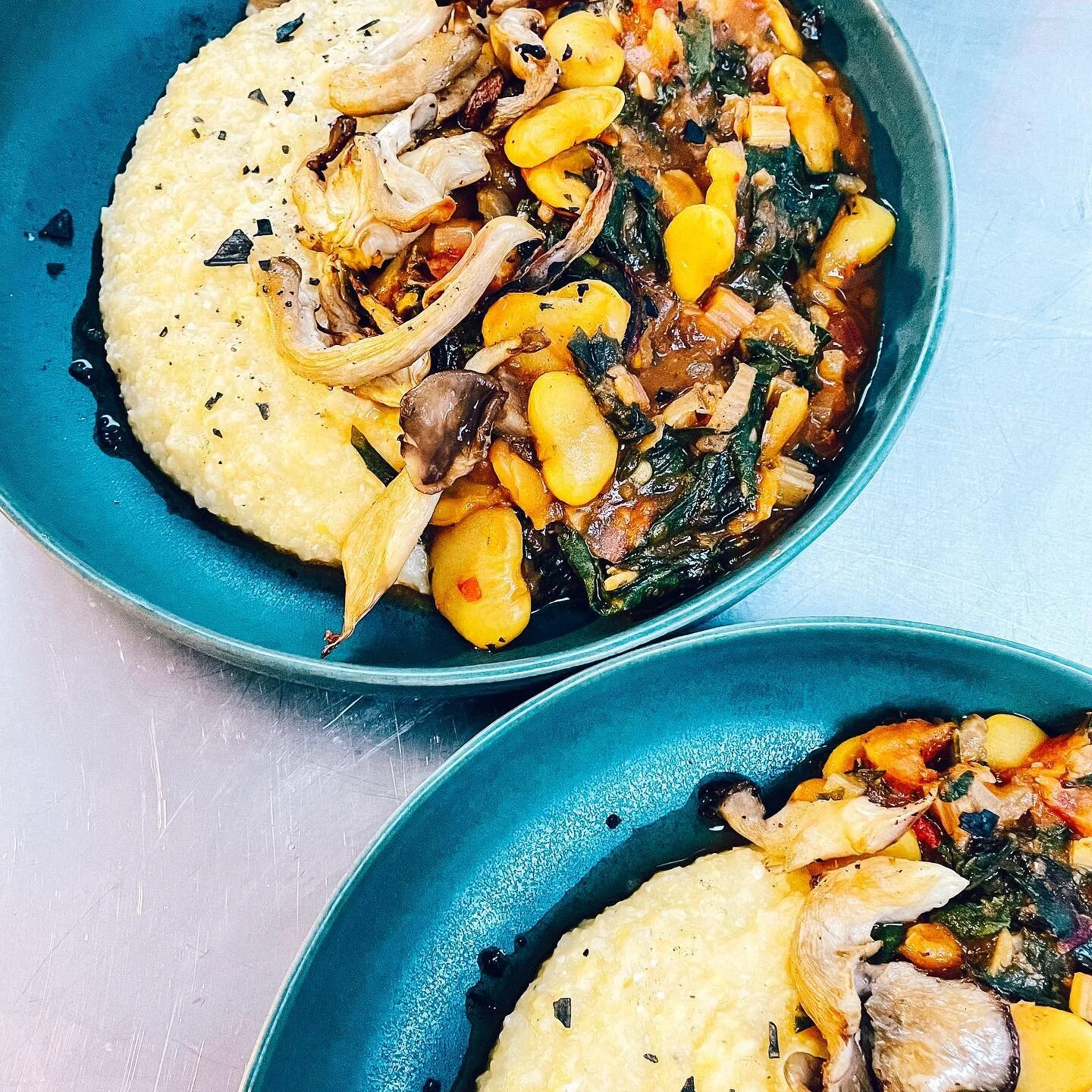 What&rsquo;s for dinner? Creamy polenta with a rainbow chard, tomato &amp; turmeric butter bean ragout and topped with roasted maitake mushrooms. Maybe not the most summery dinner, but so good and comforting 🤷🏻&zwj;♀️ #eatingwitheva