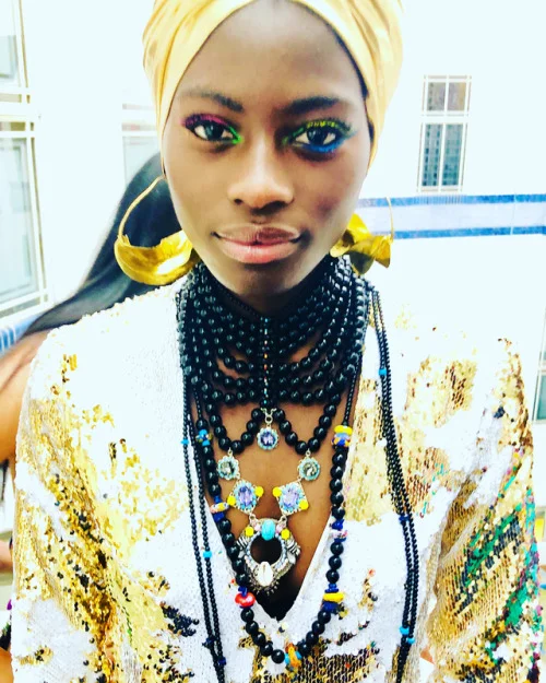 Model wearing 'Golden Girl' dress