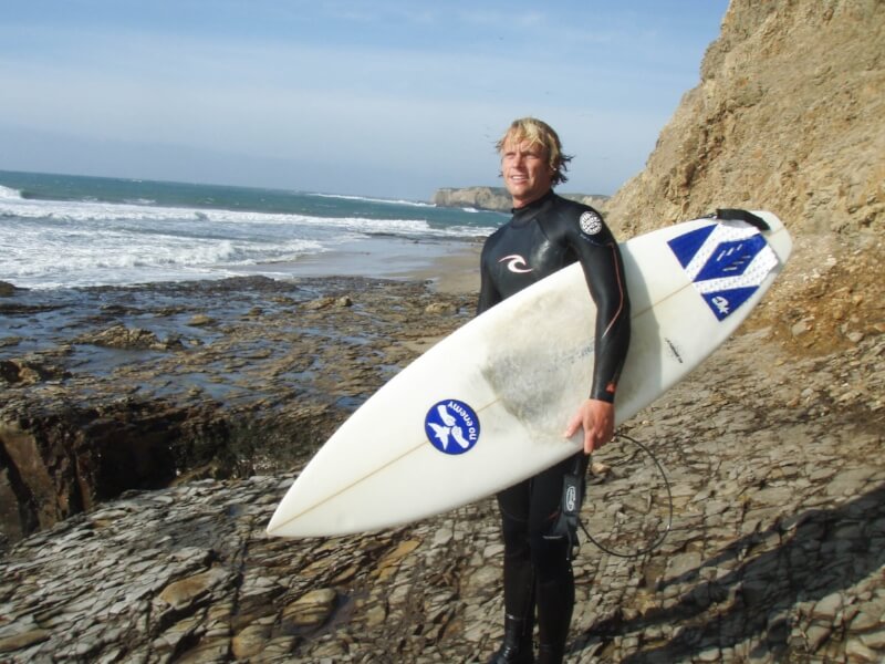 The Coast Ridge co-founder Yarrow Schley with surfboard.