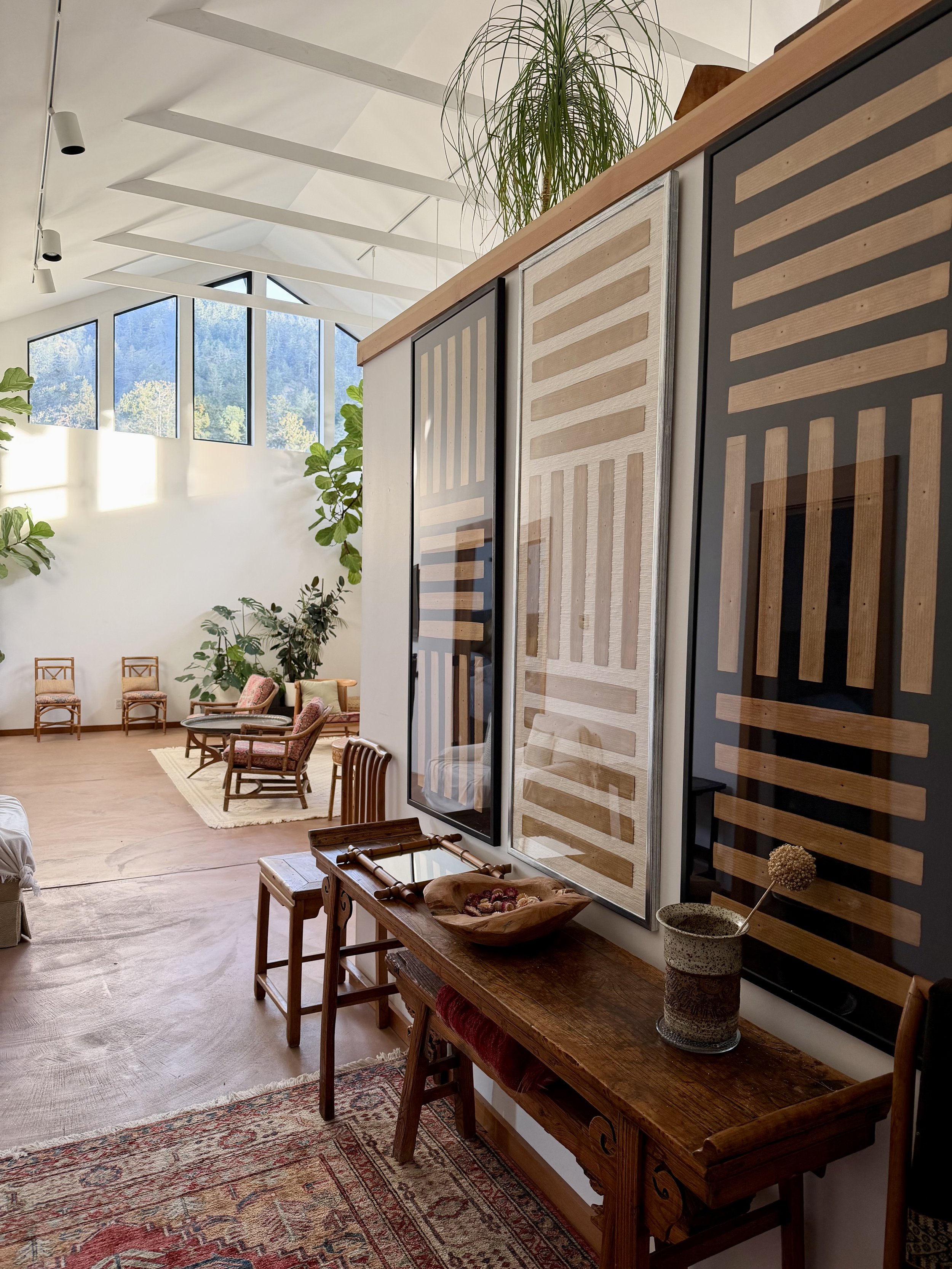 Buddhist monk scrolls line the entrance into a light filled space.  