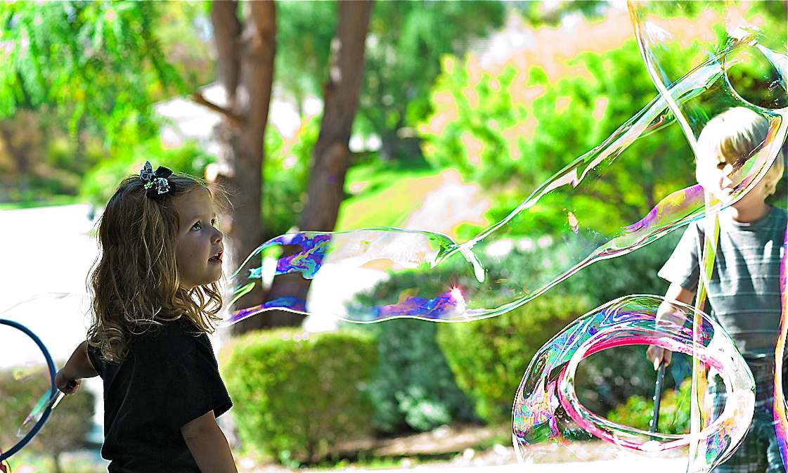 girl and boy  with buble outside cropped.jpg