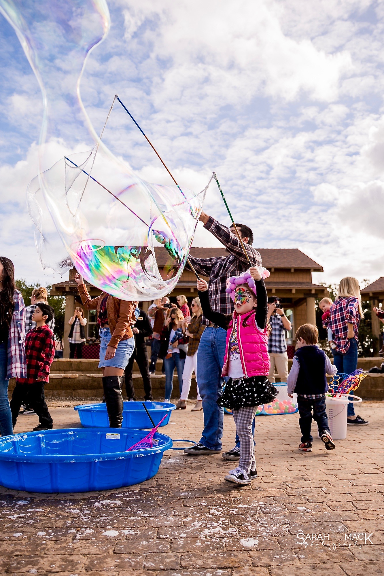 girl and dadd making giant bubbles.jpg