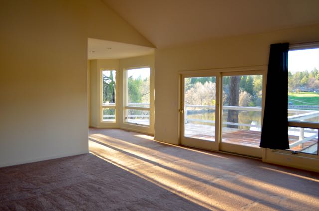 View of the family room, looking into the dining area. View of lake out the back.