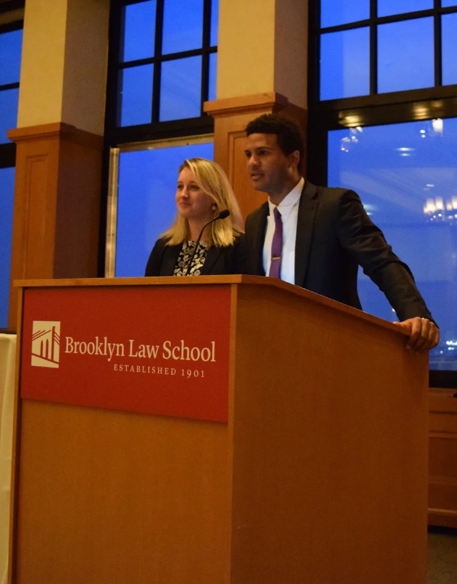 Vaughn Bobb-Willis and Lauren Rayner Davis, Co-Presidents of BESLS, address the attendees of the 2017 Alumni Dinner.