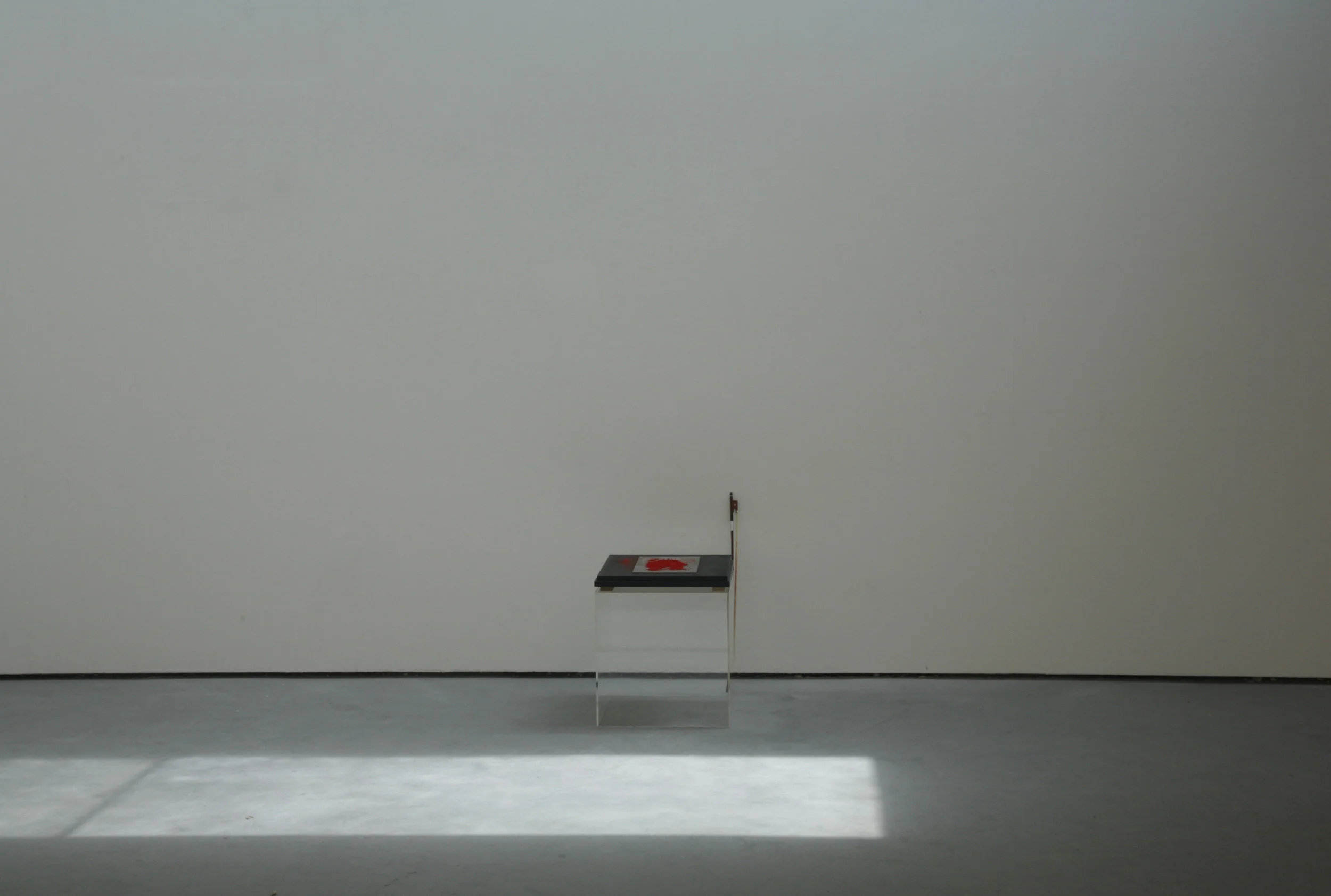 Resonant Plates. Cadmium red pigment on steel plates bowed with violin. Dimensions variable