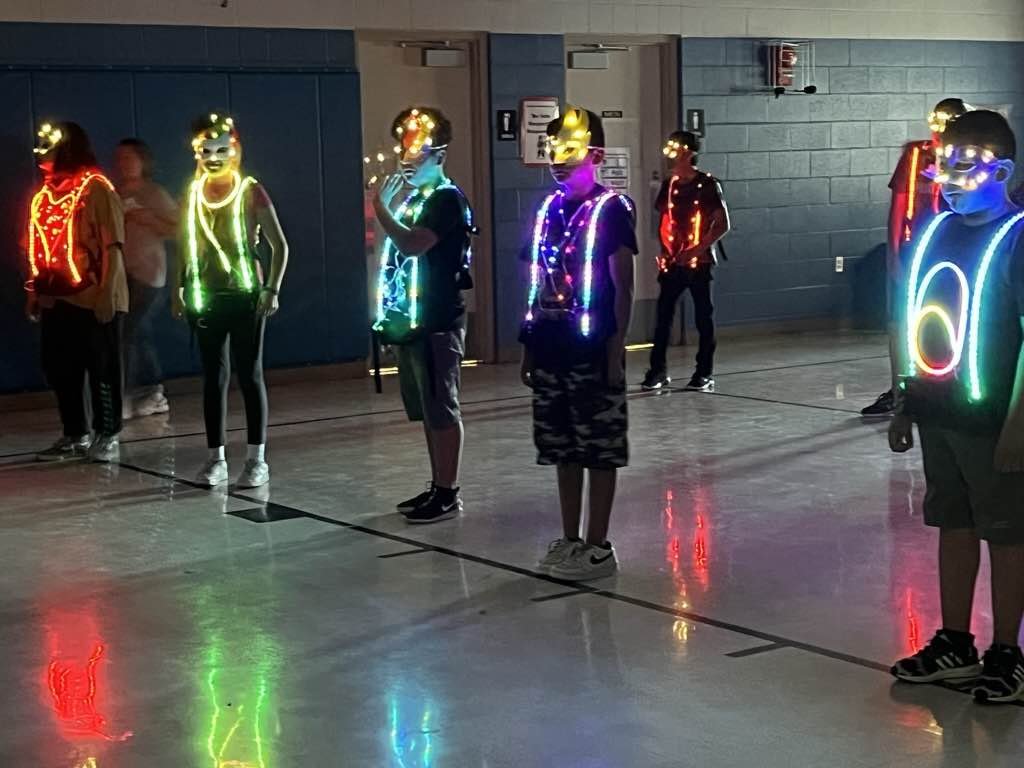 Students wearing glow sticks