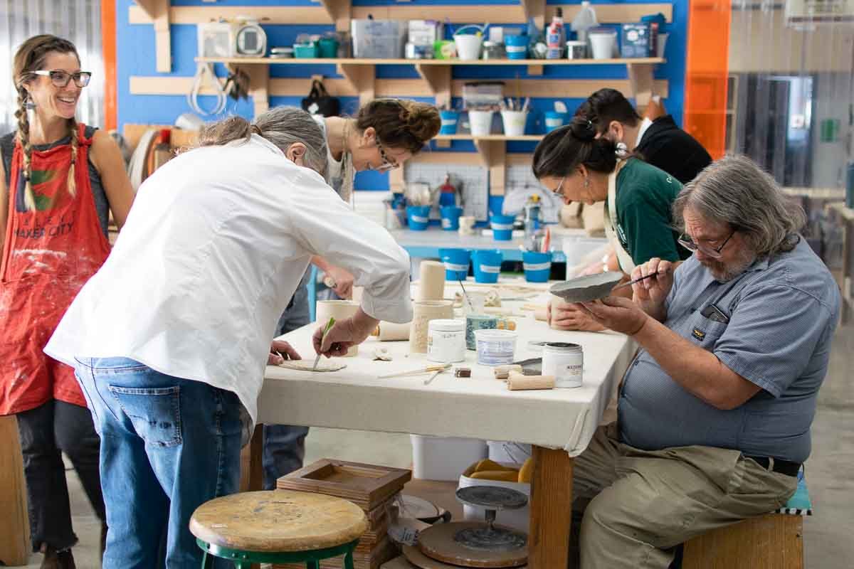 Group of people sitting at ceramic table at Talent Maker City (Copy) (Copy) (Copy) (Copy) (Copy) (Copy) (Copy) (Copy) (Copy) (Copy) (Copy) (Copy) (Copy) (Copy) (Copy) (Copy) (Copy) (Copy) (Copy (Copy)