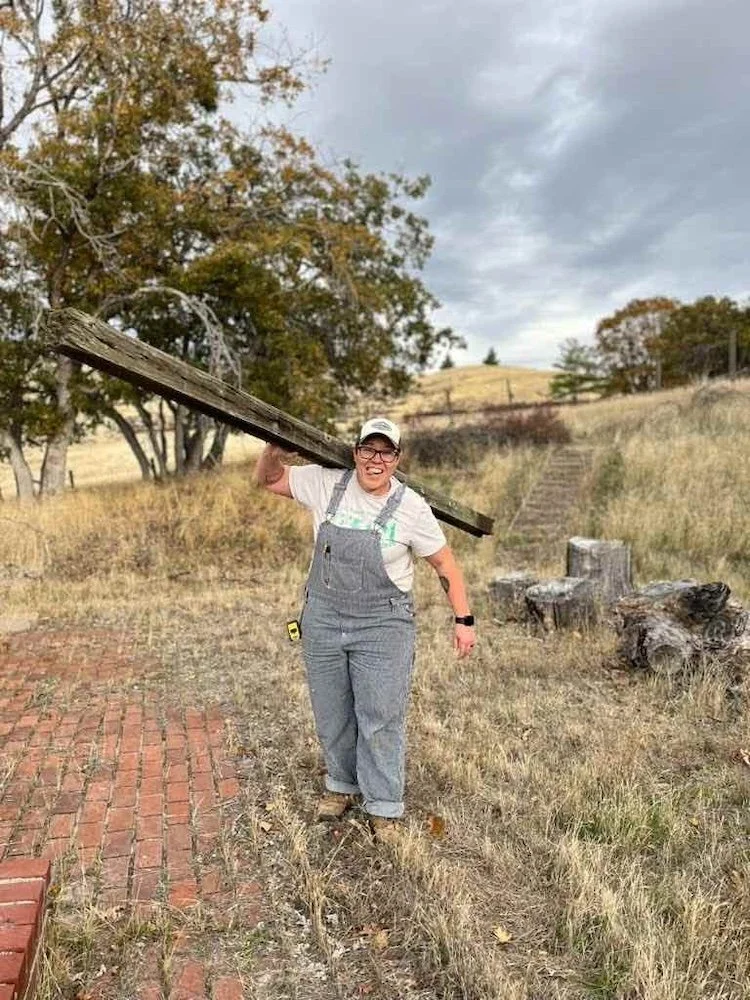 Kolby holding a long fence post