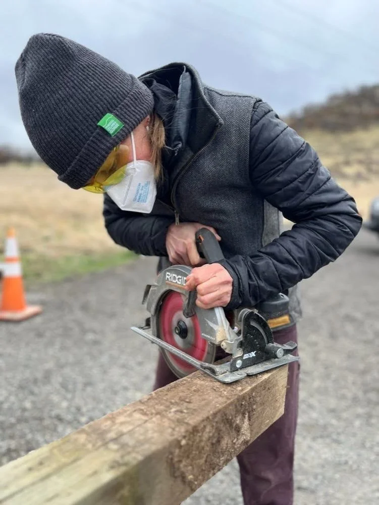 Person using a skill saw to make a cut