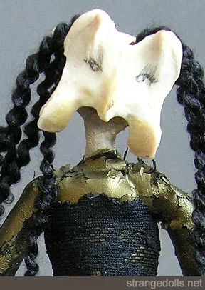 This pretty girl is made from turkey bones for her arms and head. She is 12" tall by 4" wide.