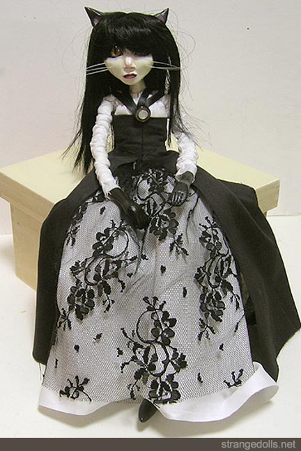 This kitty is 16 inches tall. She is hand sculpted from Fimo and Apoxie Sculpt. Her eyes are Glass Lynx eyes. 