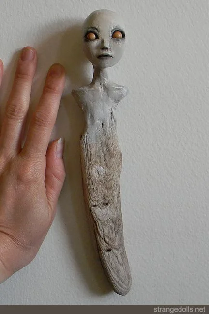 They are 9" and 10" long. They both have a wire on the back so they can hang on the wall. They were made in 2012.