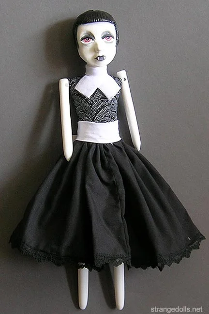 Val was a series of flapper vamps I made in 2013. She has a rag doll quality, much like all of the cast resin dolls I have made. She is 12" tall and her clothing is hand sewn. 