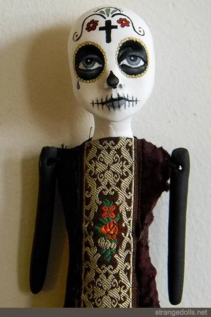 The body is hand sewn using vintage materials combined with modern spiderweb lace. This series of dolls were made a hanger on the back of the head so that she can hang on a wall.