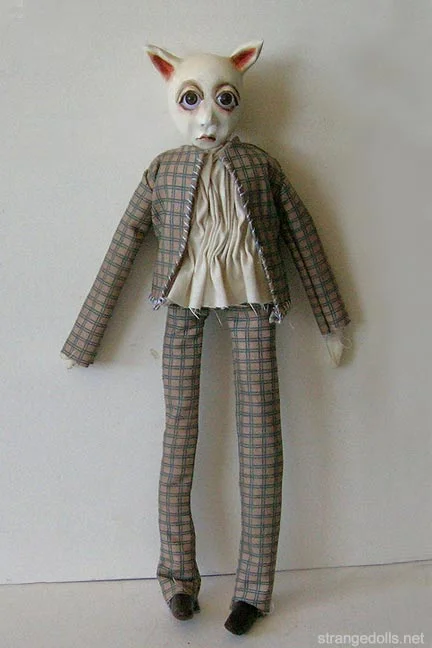 Mr. Jones is 11 inches tall. It is hand sculpted from polymer clay and Apoxie Sculpt. This piece was created in 2007.