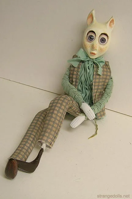 His body is made using a wire armature so that he can be better posed. This piece was created in 2006.