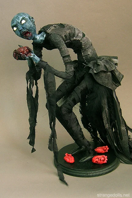 The "Eat Your Heart Out" Dolls were created in 2014 to celebrate the Valentine's season with a little dash of ferocity. I created 3 sculptures for this theme, as well accompanying jewelry.