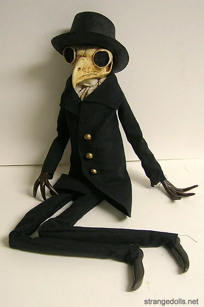 Dr. Scops is one of the original Strange Dolls designs. He was created in 2014. He is a simple but powerful design, bringing in references to plague doctors and our connection to birds in our collective unconscious. 