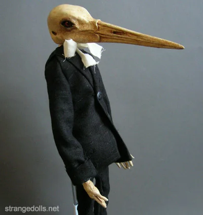 Otto is an anthropomorphic bird doll. He stands 18" tall and was hand sculpted from Apoxie Sculpt. His head is a resin cast of a sandhill crane.