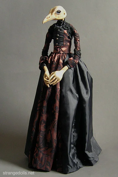 Josefa is an anthropomorphic bird doll. She stands 18" tall and was hand sculpted from Apoxie Sculpt. Her head is a resin cast of a peacock skull.
